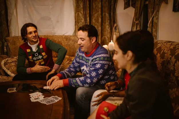 A photo of a group of people participating in an escape room experience at Casa Loma, showcasing the historic interior of the castle with participants deeply engaged in the puzzle.